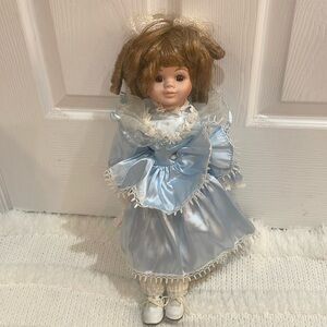 Vintage porcelain doll blonde ringlet
brown eyes blue dress bloomers shoes stand